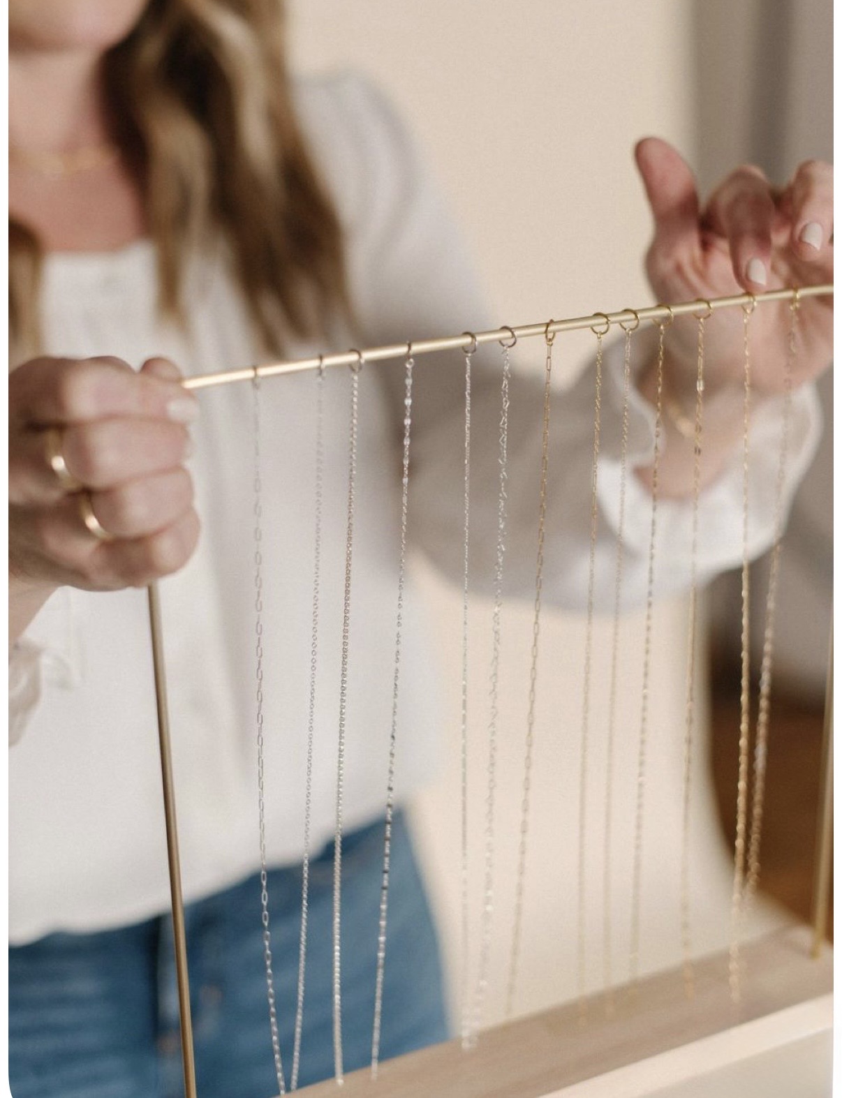 A curated display of fine jewelry chains