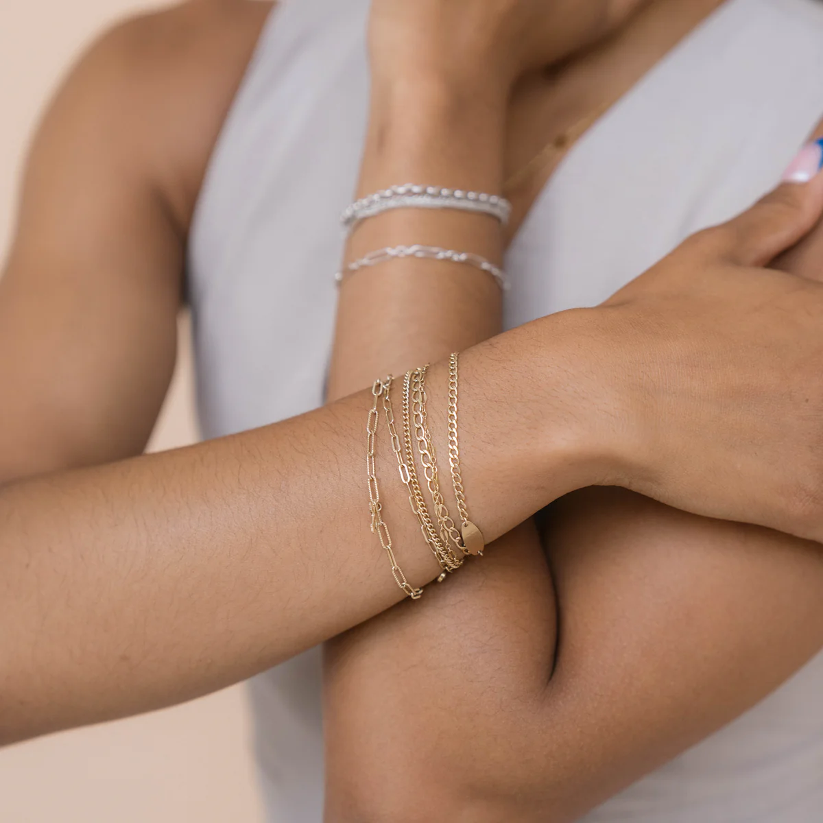 Layered gold and silver bracelets