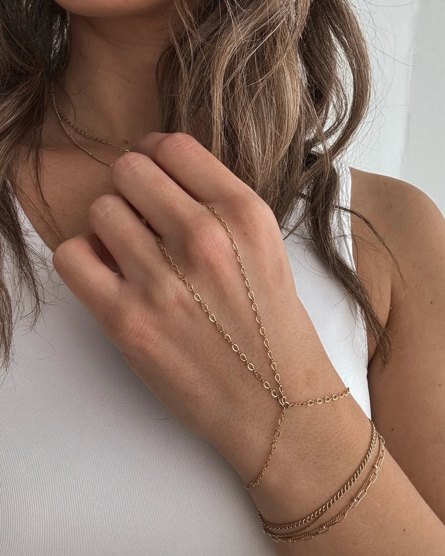 Layered bracelets and a hand chain